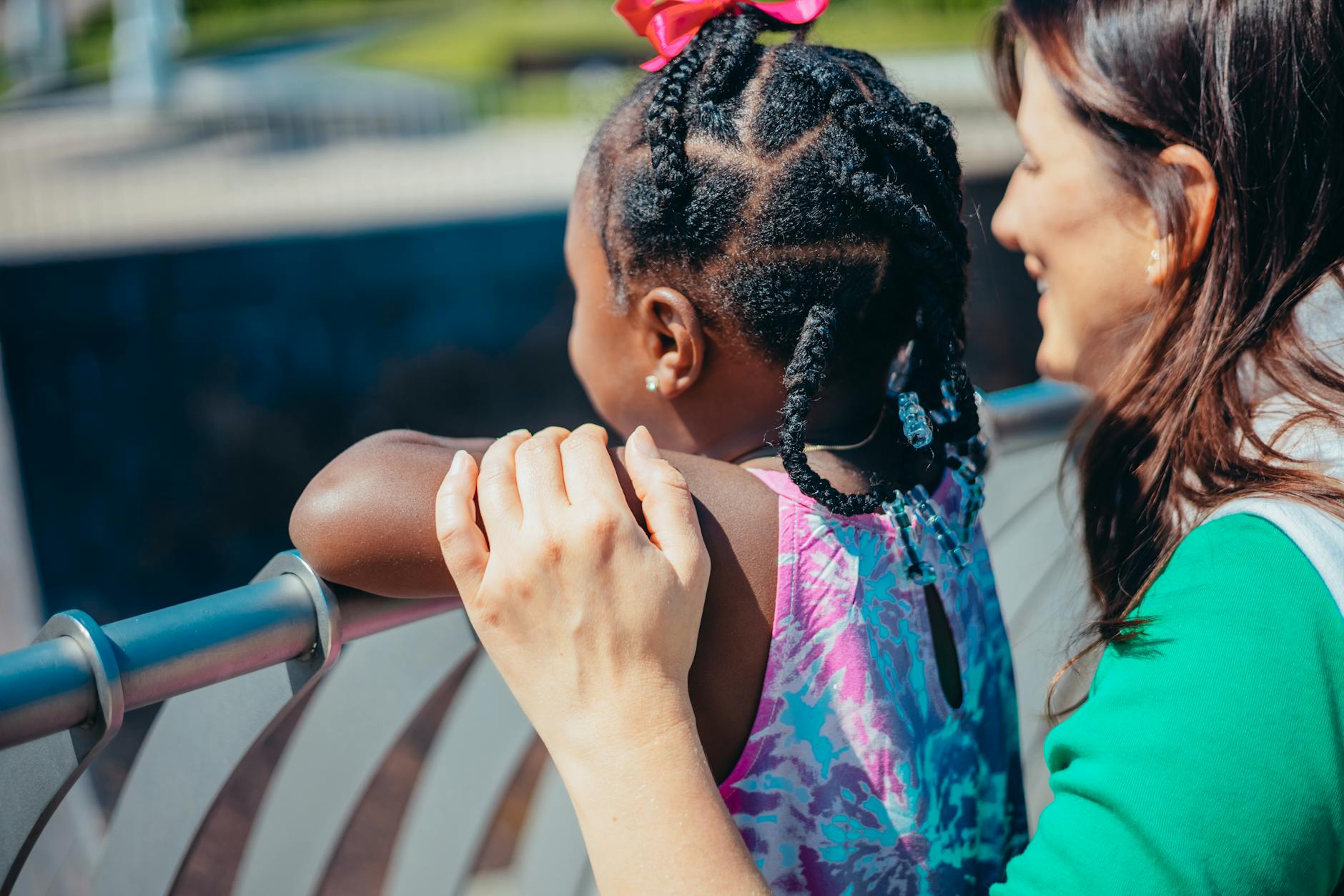 A heartwarming moment between a mother and daughter enjoying time outdoors. - fostering independence children