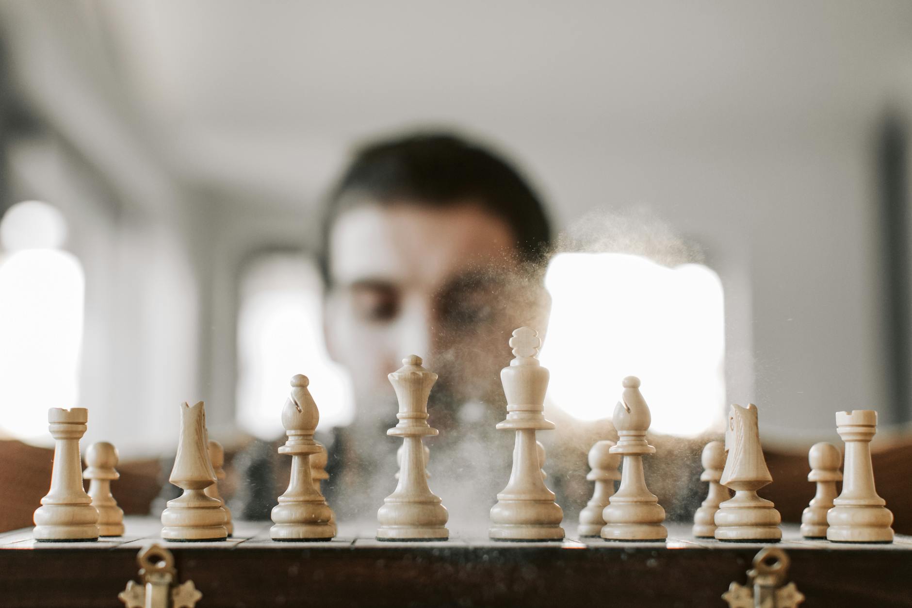 Close-up of a chessboard with chess pieces in action, representing strategy and concentration. - overcome mental fog