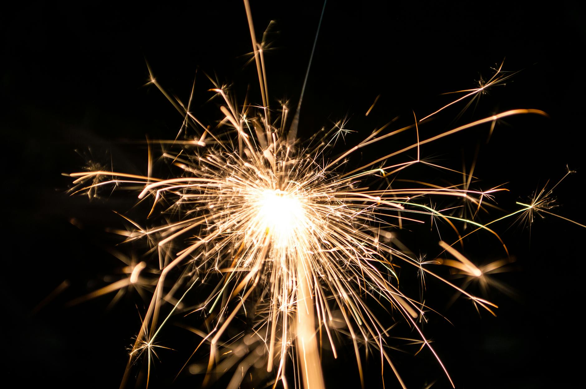 Close-up of a bright firework illuminating a dark night sky, perfect for festive events. - reignite relationship spark