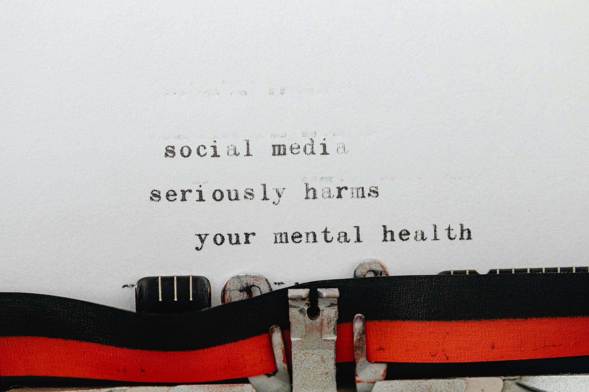 Vintage typewriter conveying message on social media's impact on mental health. - mental health reset