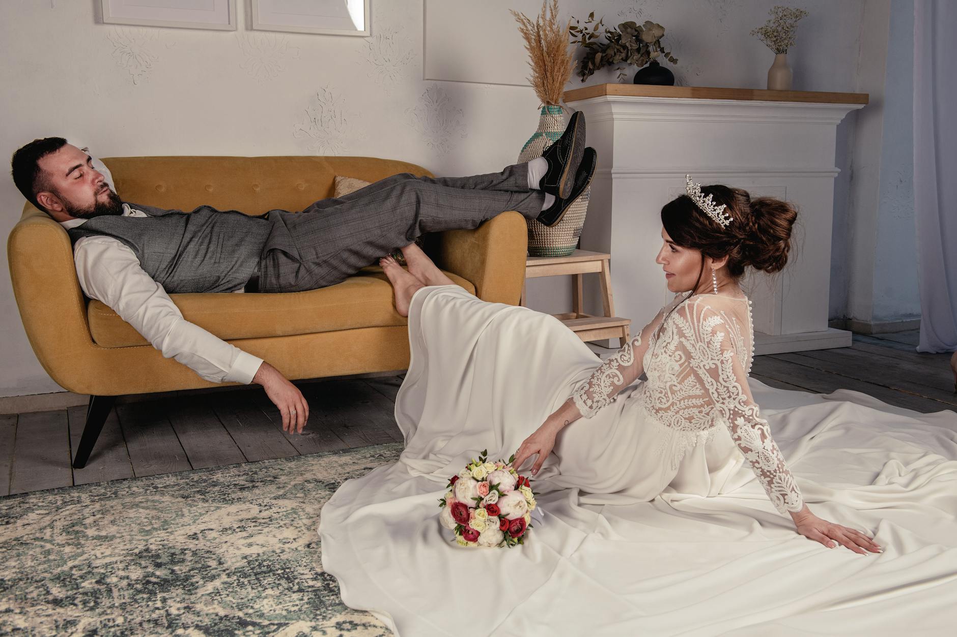 Bride and groom in a relaxed pose indoors, showcasing a modern wedding style with a romantic touch. - wedding stress relief