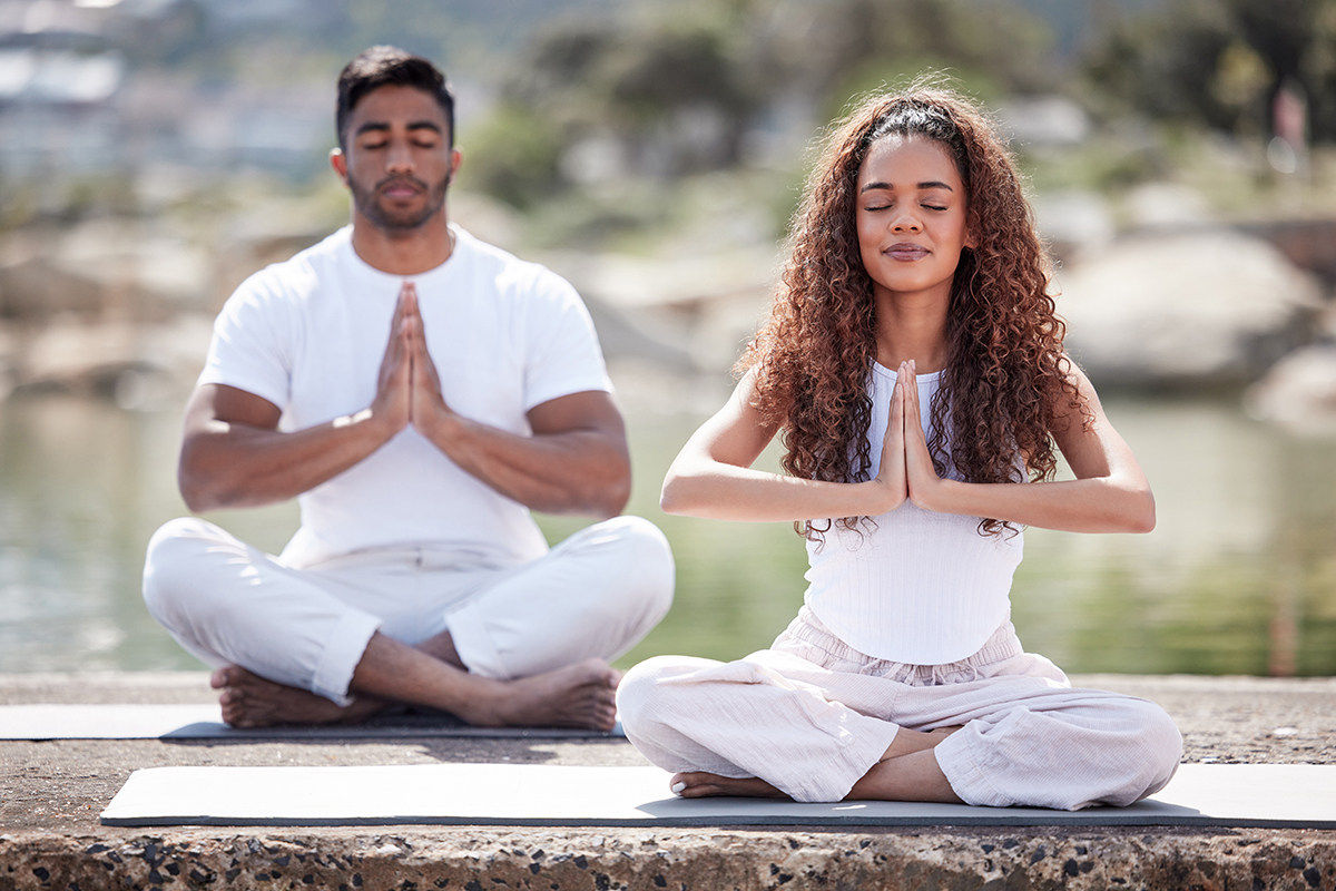 Young couple practicing yoga