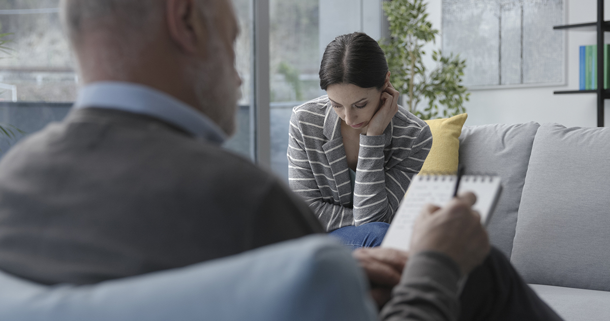 Professional therapist listening to a patient