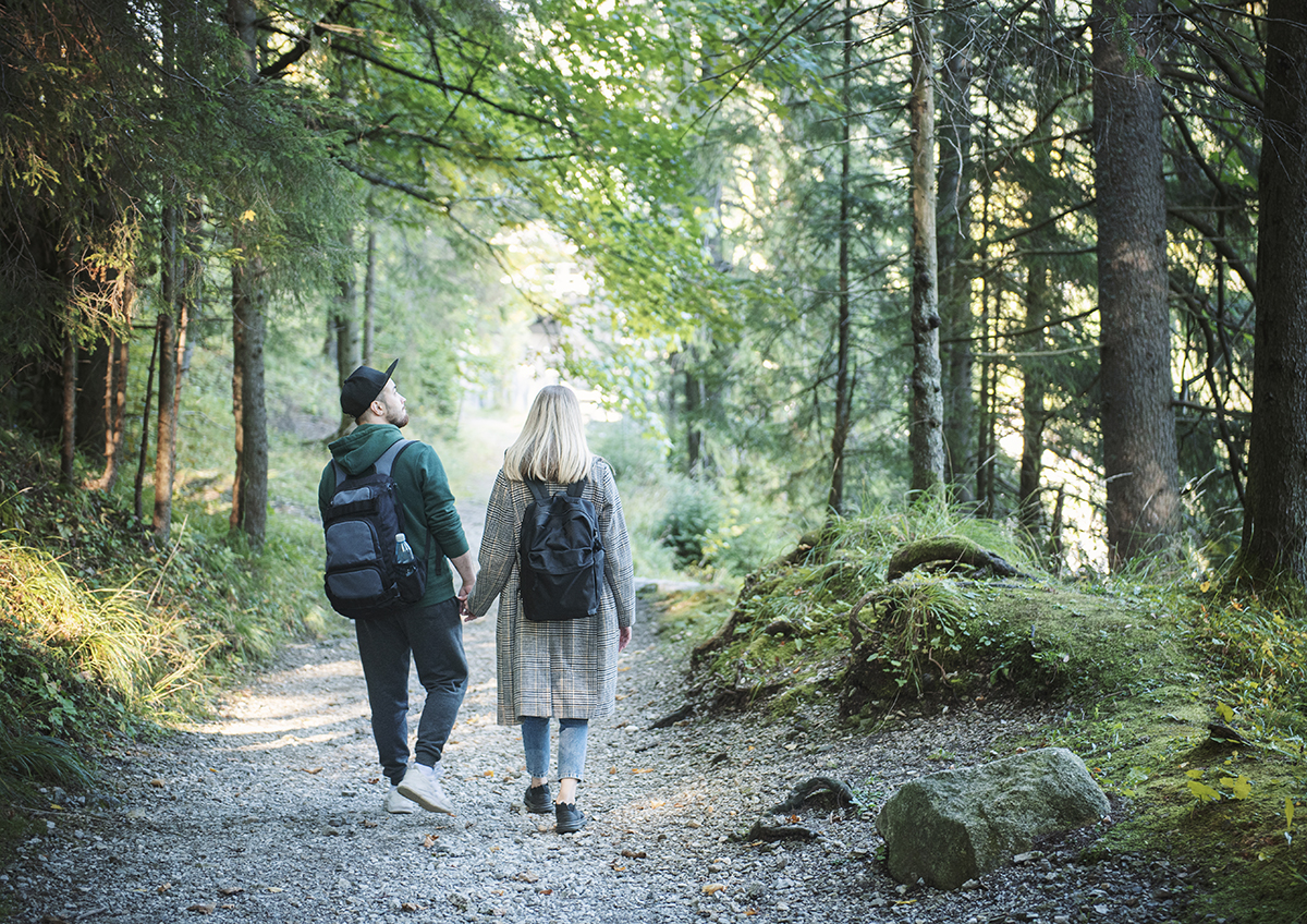 Couple in love enjoying in the forest - enhancing relationships with CBT