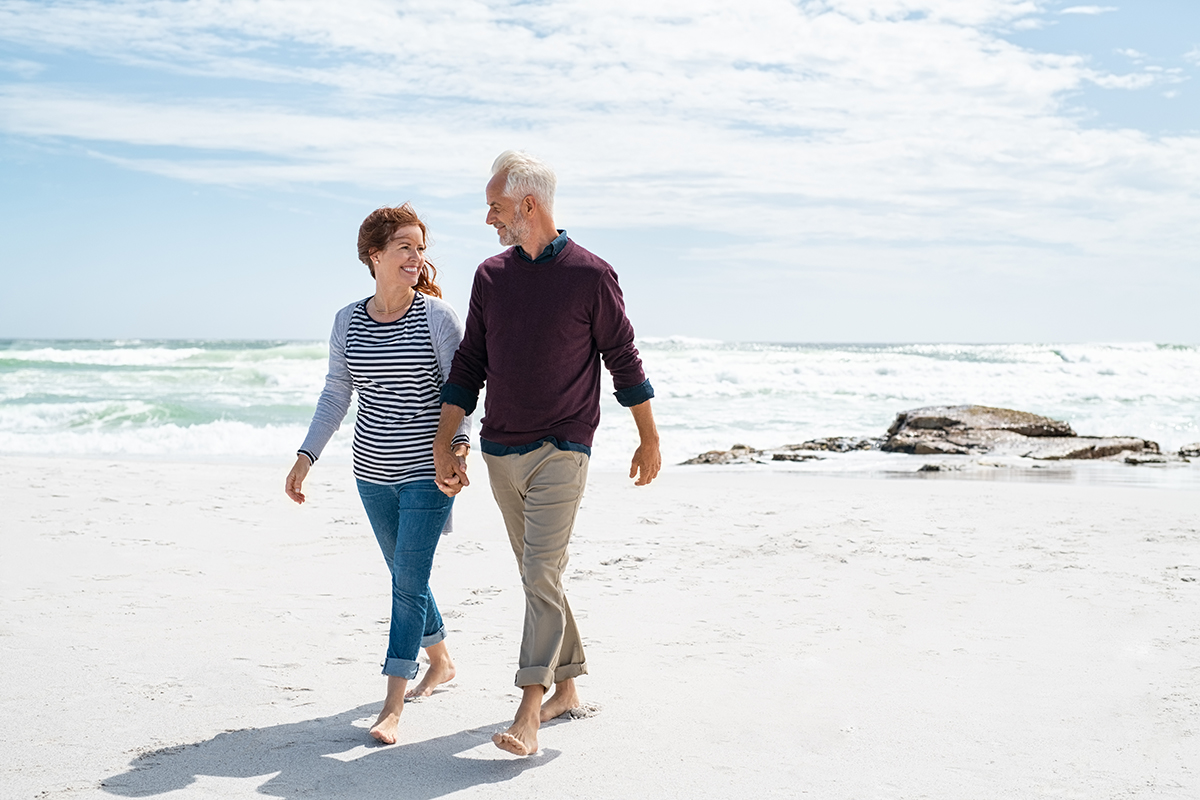 A couple in an age gap relationship walking hand in hand