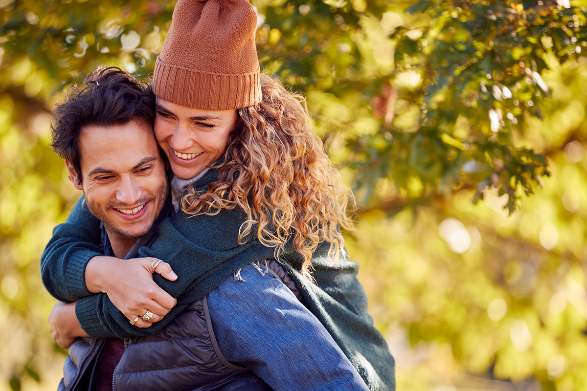 A couple smiling, representing the key takeaways on managing relationship conflict