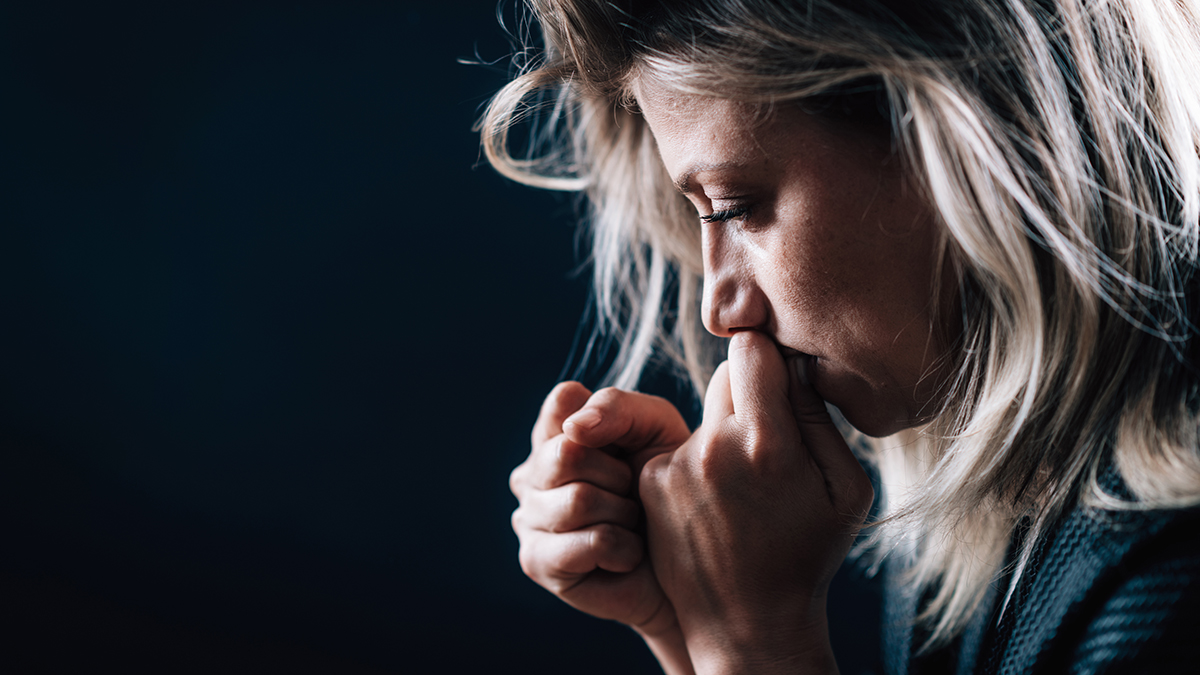 Portrait of a troubled woman, illustrating the anxiety and signs of trauma in someone who was abused by a narcissist