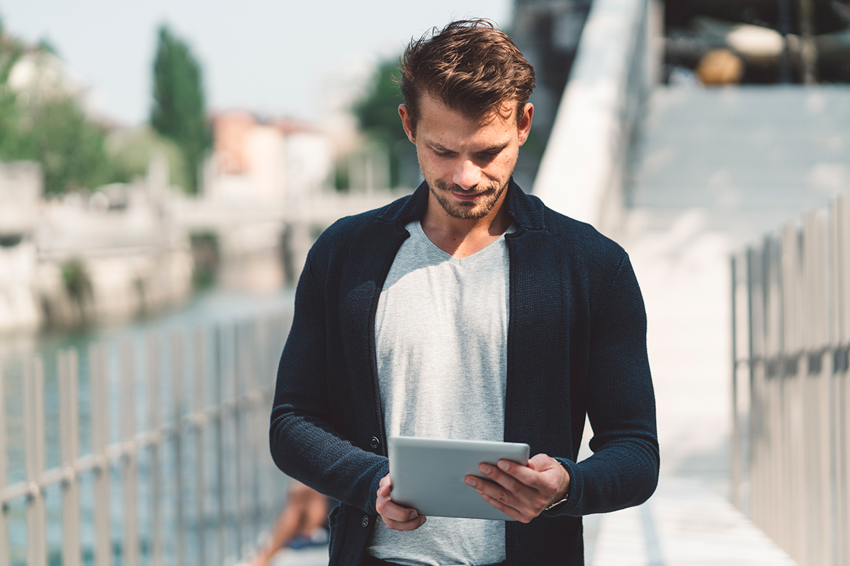 Individual reflecting on their authentic dating profile on a digital device