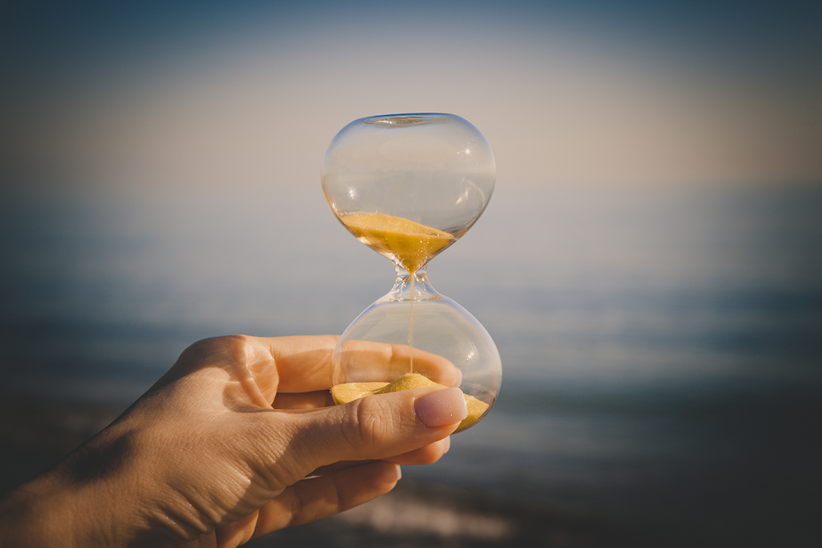 Sand clock representing the passage of time and the need for patience