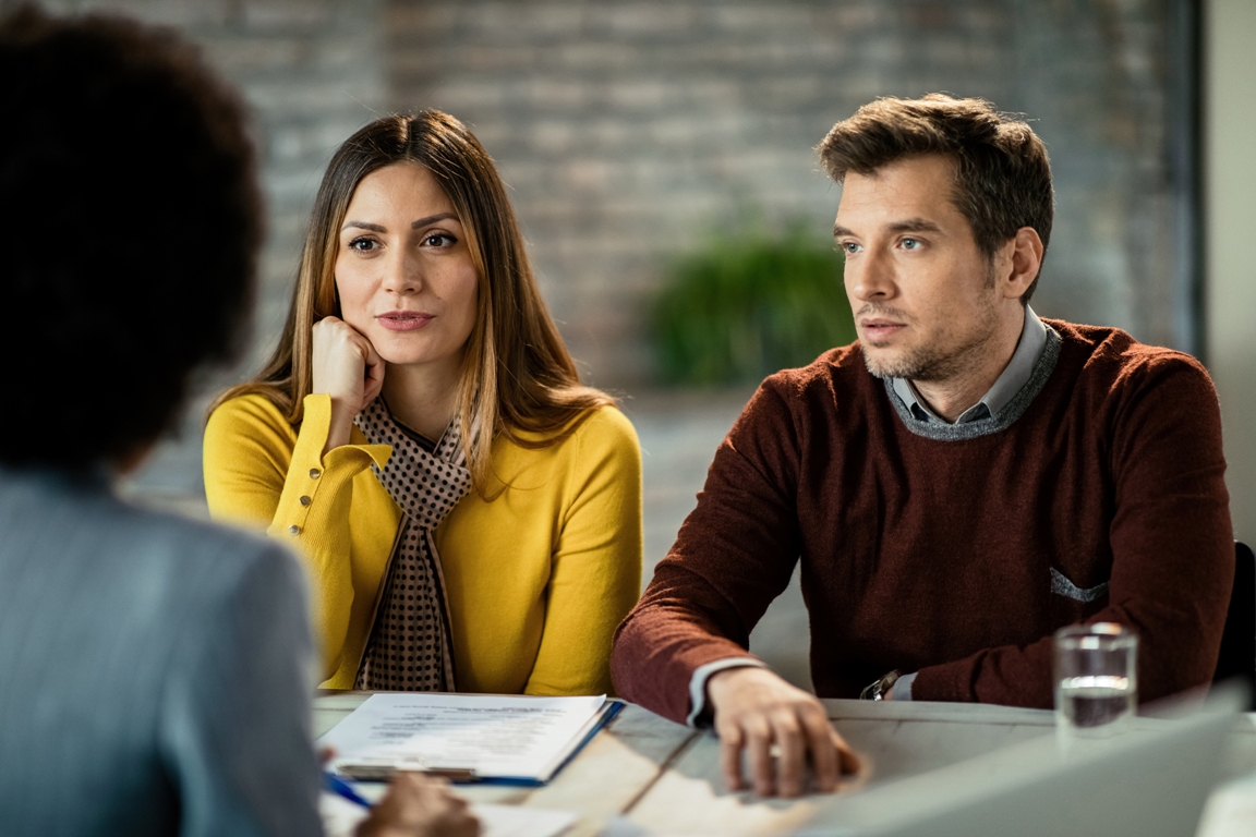 Couple in therapy session with a counselor