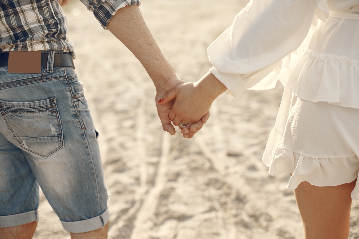 Couple holding hands