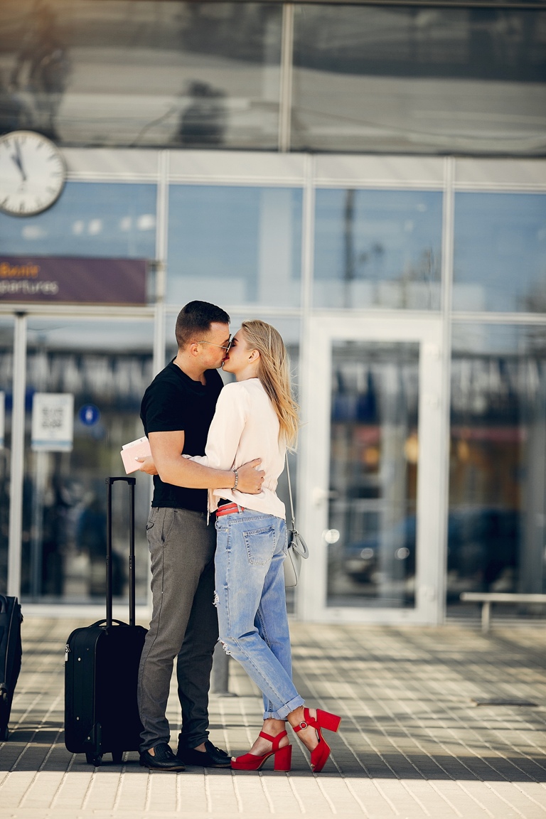 Couple hugging at the airport