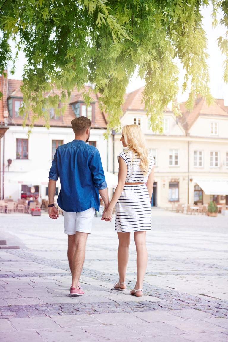 Couple walking together hand in hand