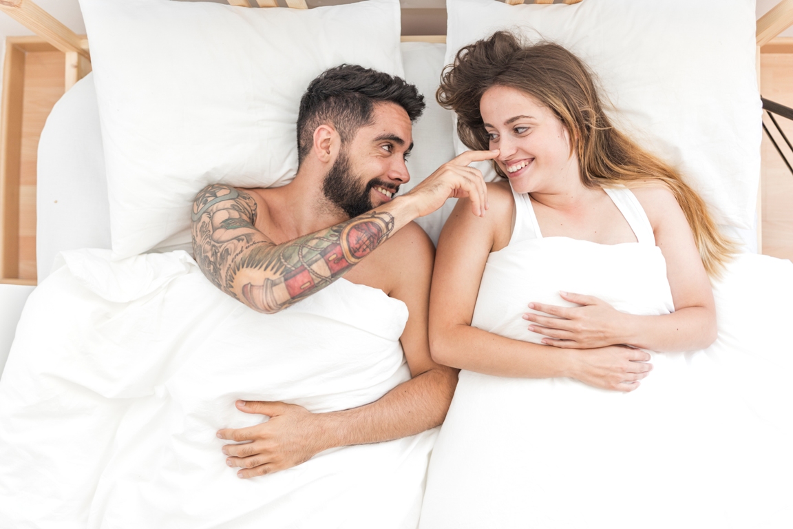 Couple enjoying relaxation benefits of morning sex